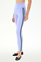 Model wears SPLITS59 Ella High Waist Airweight 7/8 leggings in Purple Haze/Black, featuring two black side stripes, paired with black ballet flats against a plain white background.