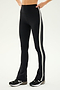 Person wearing SPLITS59's Raquel High Waist Flared Legging in black, white, and heather grey with a white side stripe and black athletic shoes, crafted from 4-way stretch supplex fabric, standing against a plain background.