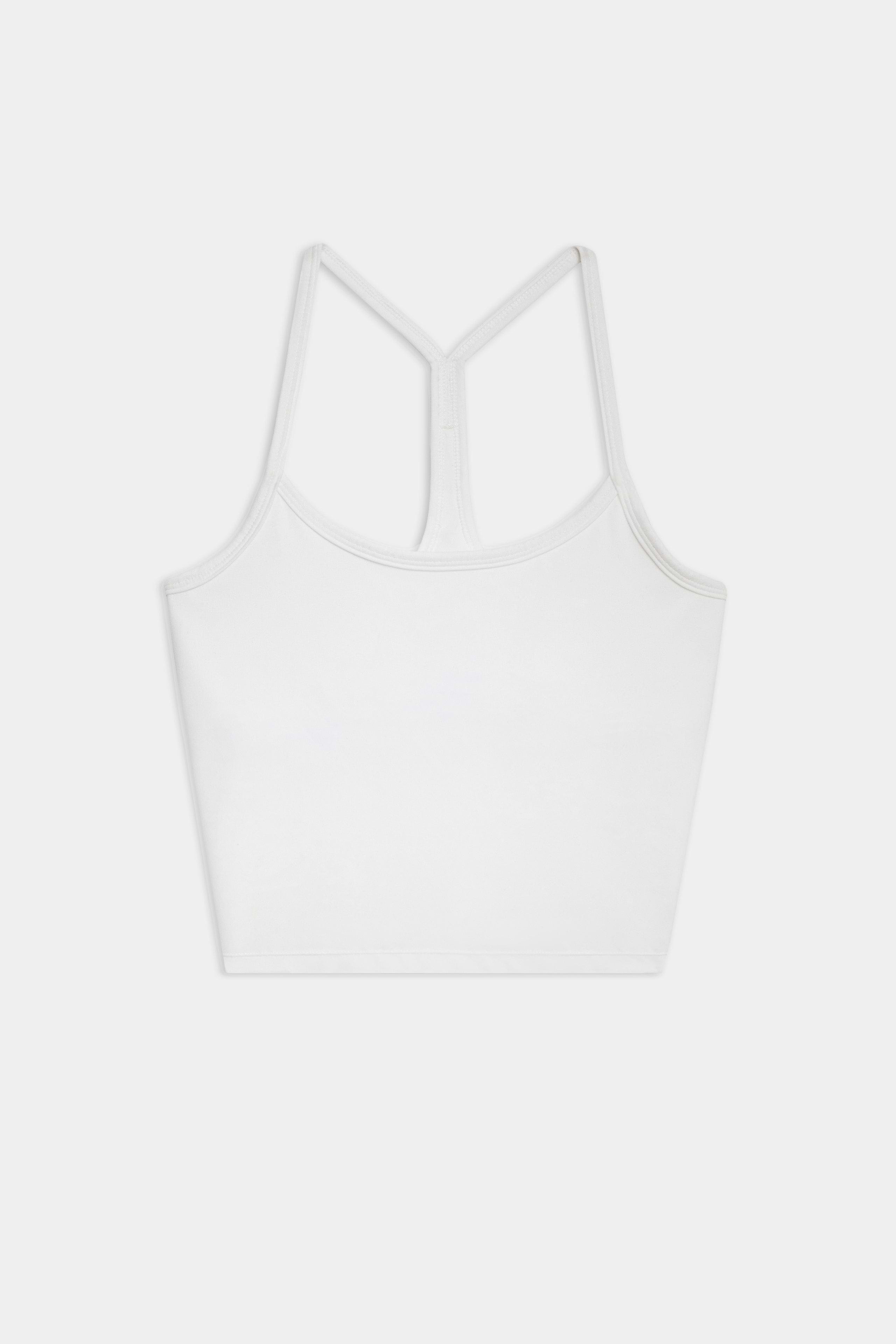 The SPLITS59 Airweight Crop - White is a racerback tank top with spaghetti straps, ideal for hot yoga, shown on a white background.