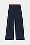 The SPLITS59 Michele Airweight Trouser in indigo features wide legs and an elastic waistband with red, white, and blue stripe detail, shown flat on a white background.