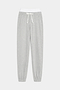 The SPLITS59 Andie Dual Waist Sweatpant in Heather Grey/White features a soft modal spandex blend, white elastic waistband, white drawstring, and elastic cuffs, shown laid flat on a plain background.