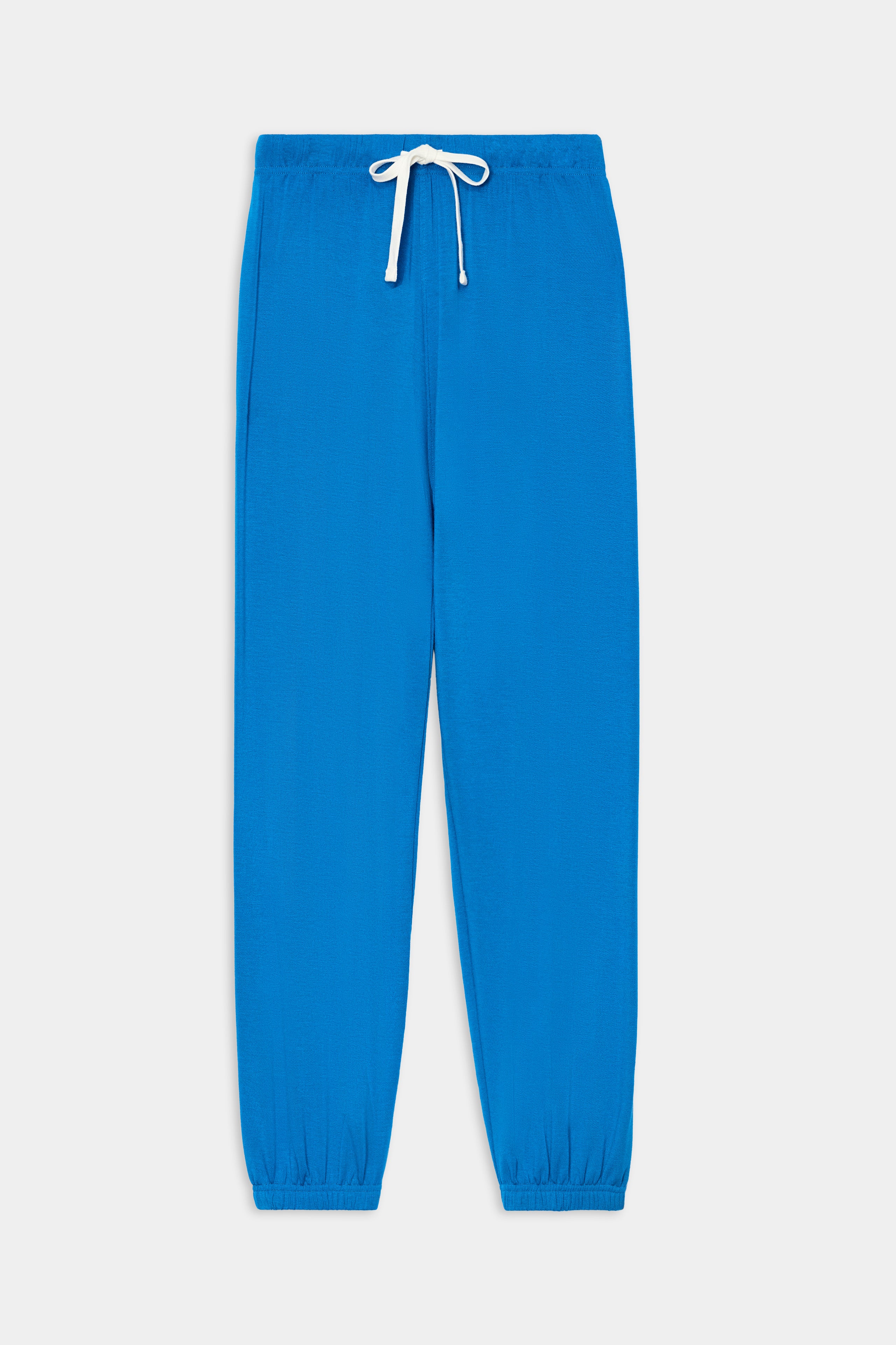 The SPLITS59 Andie Oversized Fleece Sweatpant in Classic Blue—featuring a white drawstring, elastic waistband, and elastic cuffs—crafted from ultra-luxe fleece in Los Angeles, is shown laid flat on a white background. Perfect for cool weather workouts.