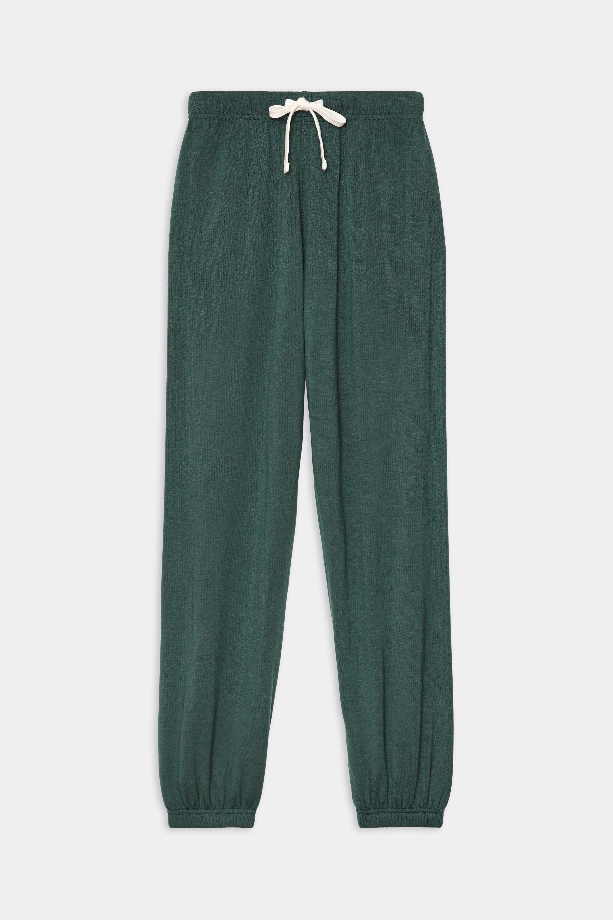 The SPLITS59 Andie Oversized Fleece Sweatpant in Military features an elastic waistband, white drawstring, and elastic cuffs—ideal for cool weather workouts. Shown laid flat on a white background.