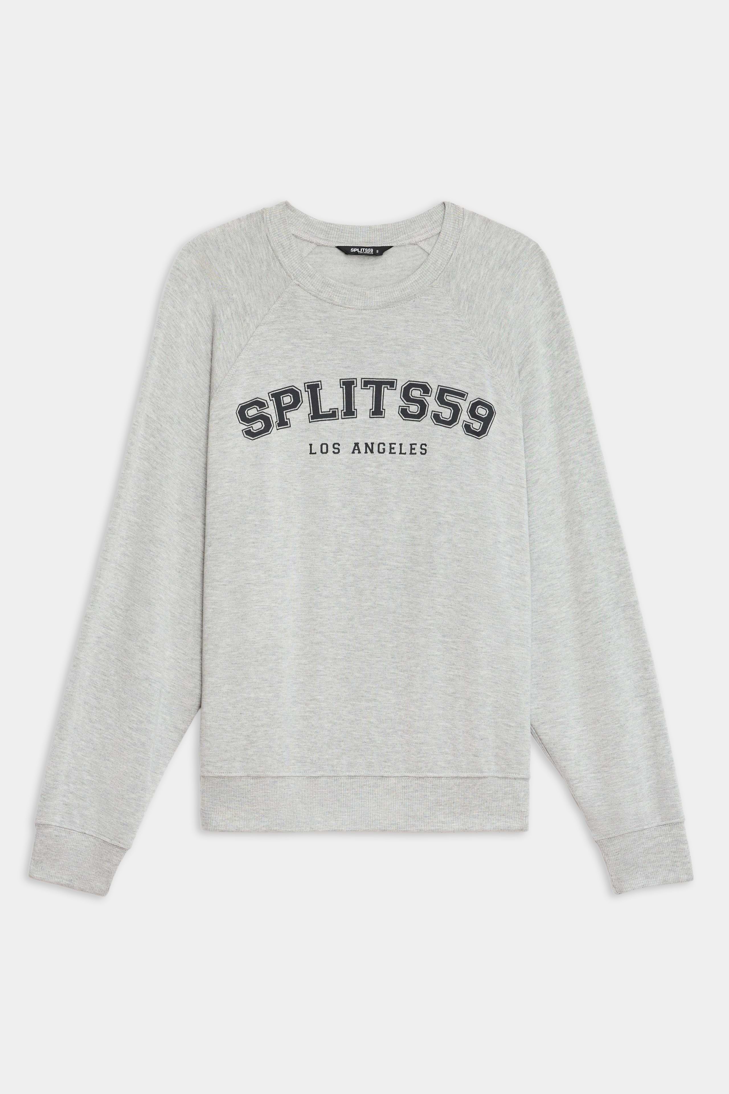 The SPLITS59 Andie Oversized Fleece Varsity Graphic Sweatshirt in Heather Grey features "SPLITS59 LOS ANGELES" printed on the front, with long sleeves and ribbed cuffs. Made in Los Angeles for a classic, cozy look.