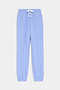 The SPLITS59 Andie Oversized Fleece Sweatpant in Purple Haze features a relaxed fit with a white drawstring waist and elastic ankle cuffs, perfect for warm weather workouts, shown against a plain white background.
