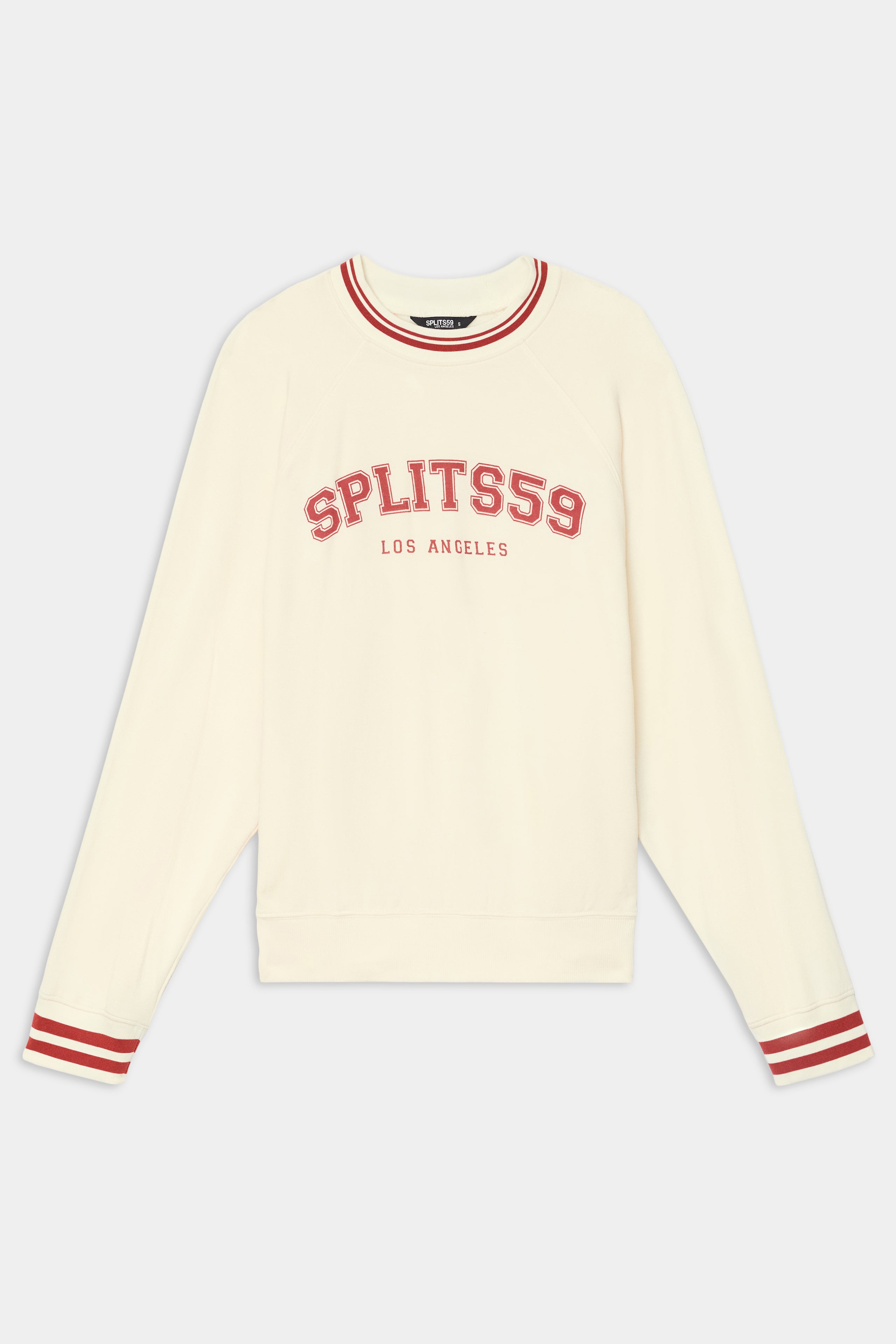 The Andie Oversized Fleece Varsity Stripe Sweatshirt - Creme/Splits59 Los Angeles by SPLITS59 features red striped cuffs, a cozy modal blend, and front “SPLITS59 LOS ANGELES” text.