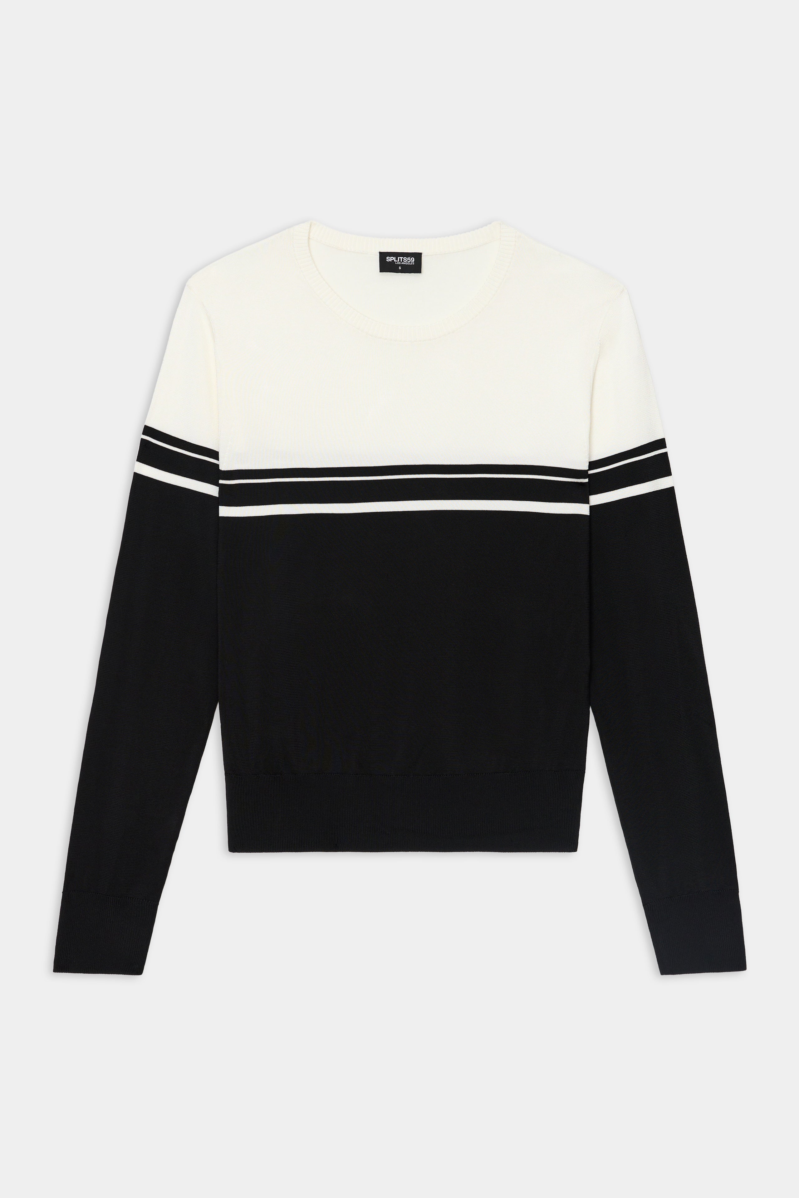 The Anna Knit Pullover - Black/White by SPLITS59 features soft rayon, a white top, black bottom, and bold black and white stripes on the chest and sleeves.