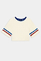 The Djuna Oversized Crop Jersey Tee - Creme/Cobalt by SPLITS59 features soft viscose, a blue collar, and blue/red striped sleeves, shown flat on a white background.