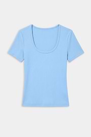 The SPLITS59 Ashby Rib Short Sleeve in Skylight, a light blue modal-spandex tee with rib texture and scoop neck, is shown laid flat on a white background.