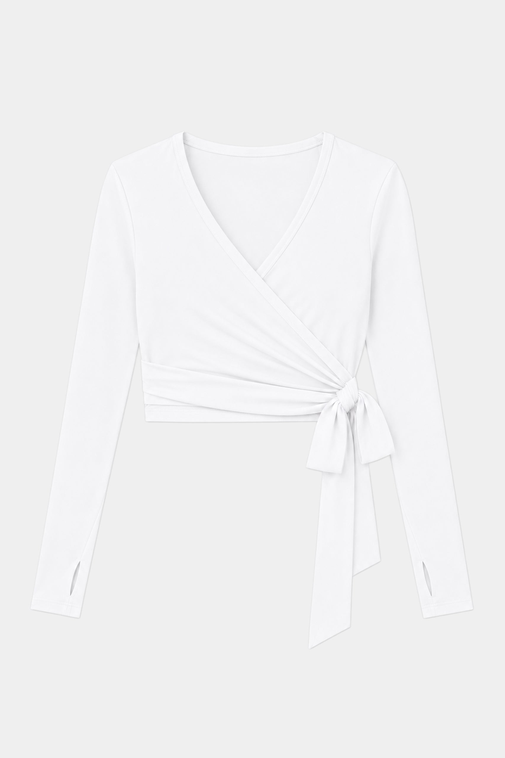 The SPLITS59 Bella Airweight Lite Wrap in white is a long-sleeve V-neck top made from a soft spandex-nylon blend with a side tie detail, shown on a plain light background.