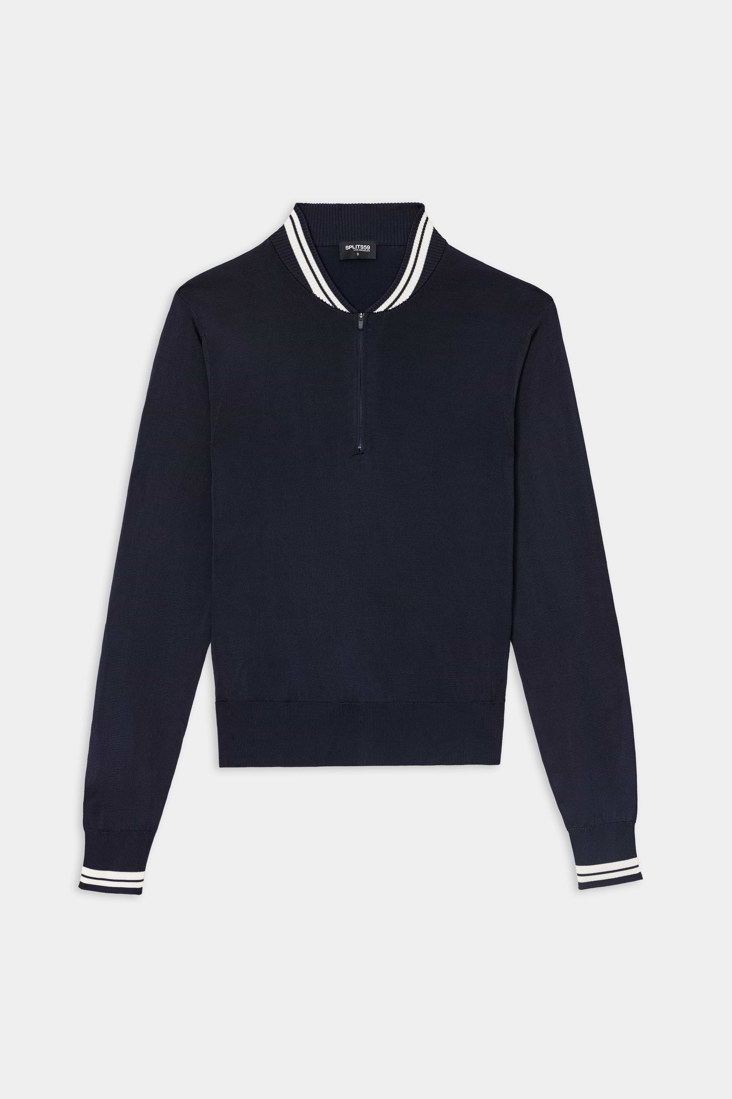The SPLITS59 Bonnie Knit Half Zip in Indigo/White is a long-sleeve pullover crafted from a soft rayon and nylon blend, featuring a quarter-zip closure and white-striped ribbed collar and cuffs, displayed laid flat on a white background.