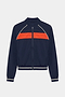 The SPLITS59 Carrie Woven Nylon Jacket in Indigo/Lotus Red features a zip-up design with a bright red chest stripe and white piping on the shoulders and cuffs, crafted from spandex and nylon.