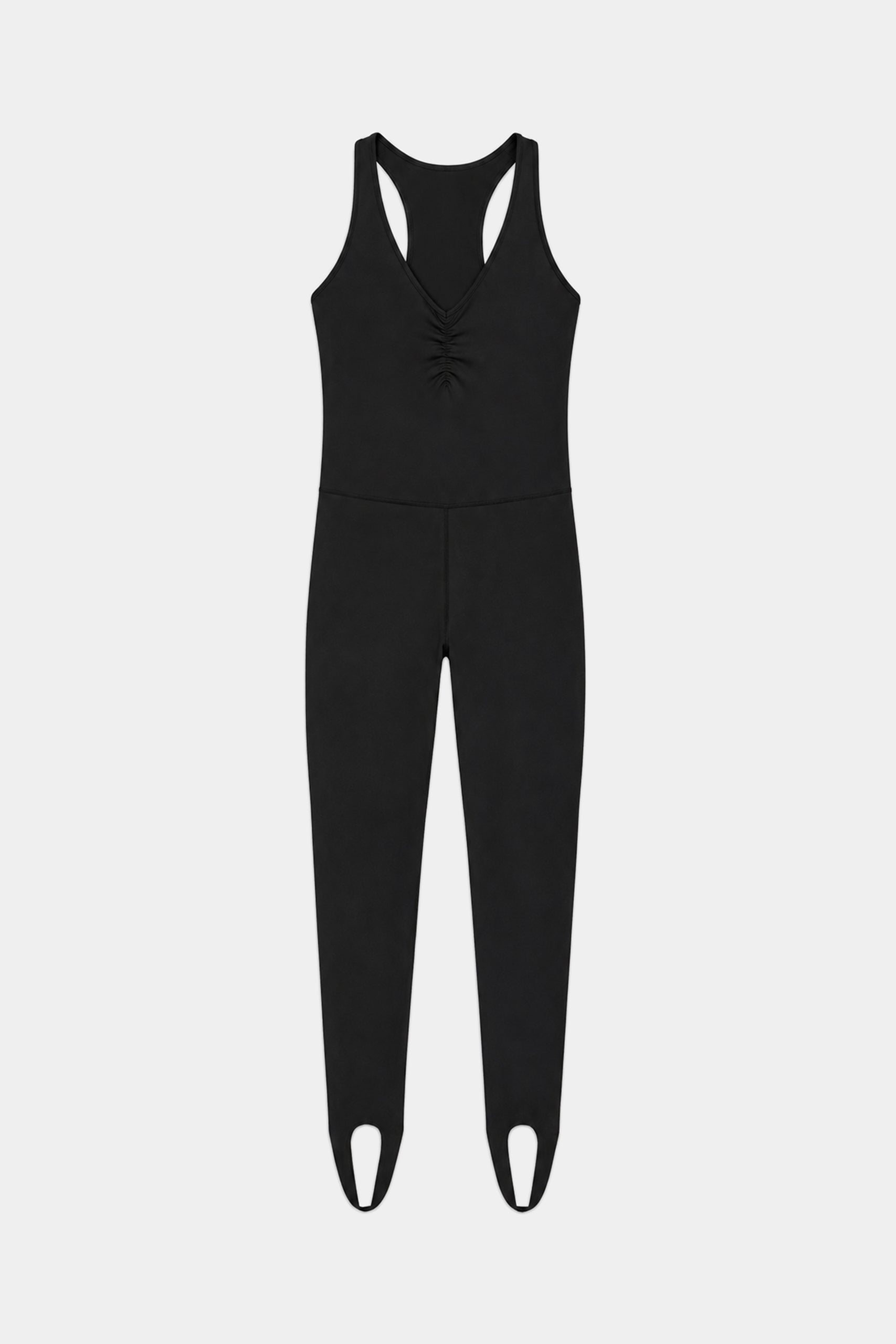 The Darci Airweight Stirrup Jumpsuit in black by SPLITS59 features a sleeveless design in a nylon-spandex blend, V-neckline, gathered front detail, fitted legs, and stirrup hems, shown laid flat on a white background.