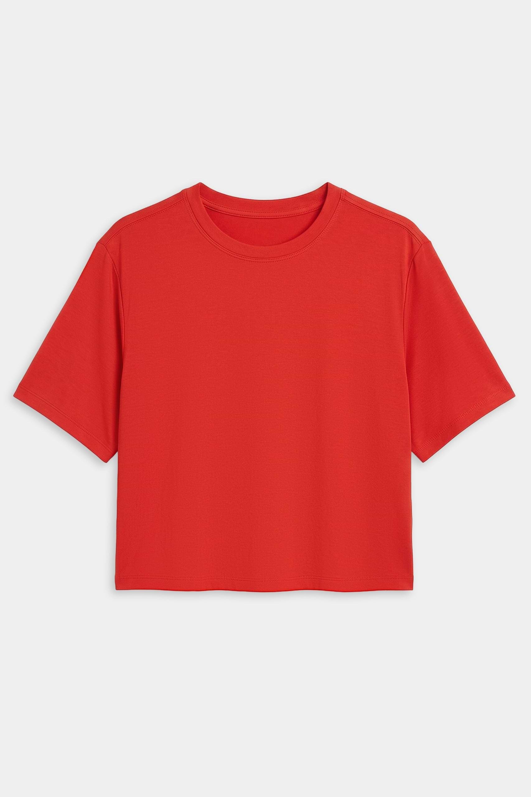The SPLITS59 Djuna Oversized Jersey Tee in Lotus Red, featuring short sleeves, is laid flat on a white background—ideal for gym workouts.