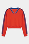 The SPLITS59 Ellie Fleece V Neck Sweatshirt in Lotus Red/Cobalt features blue double stripes on the shoulders and sleeves, a blue-trimmed V-neck, and is made from a soft spandex blend for comfort and stretch.