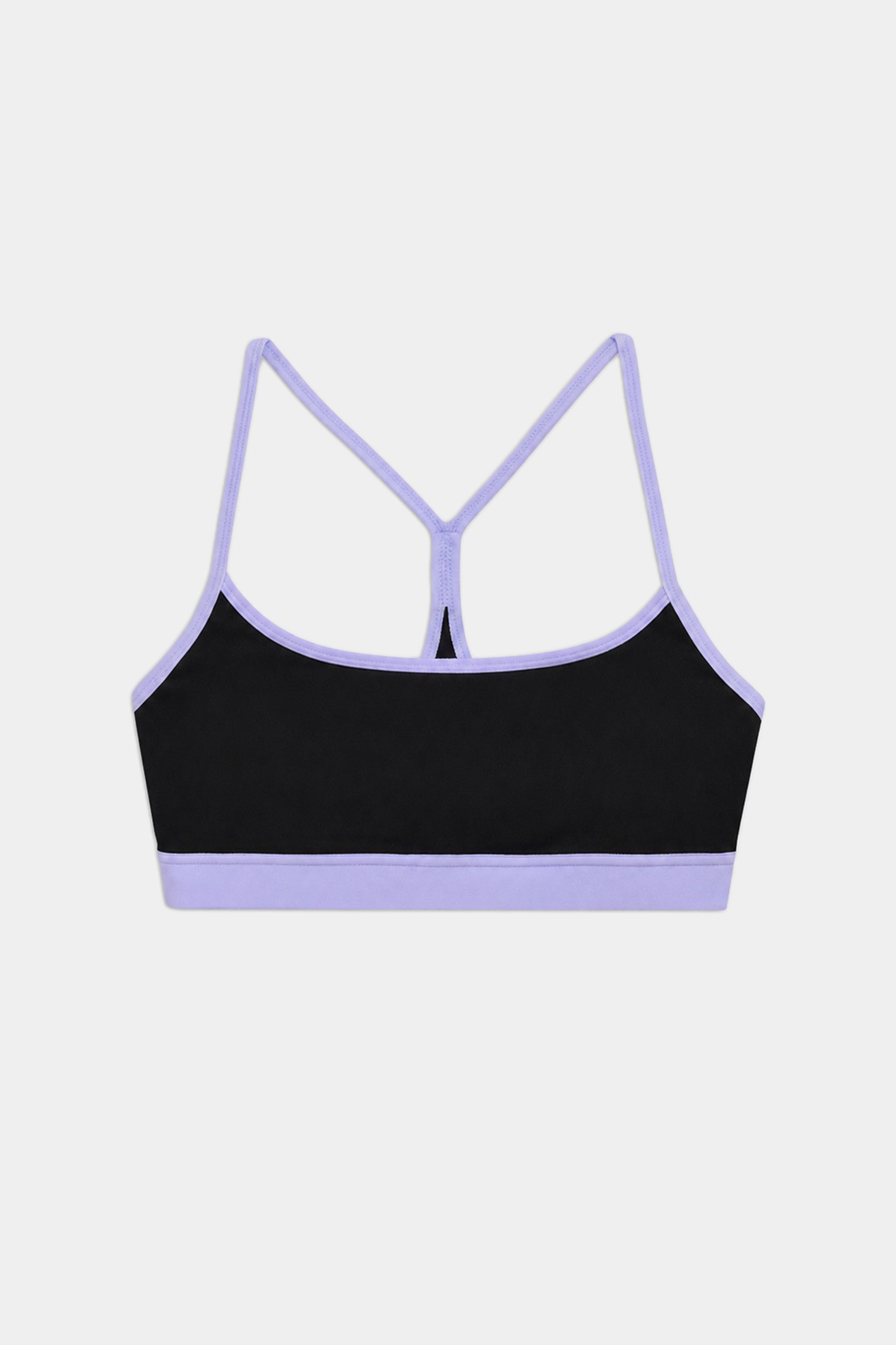 The SPLITS59 Emerson Airweight Bra in Black/Purple Haze features light purple trim and racerback straps, made from stretchy nylon spandex for comfort. Perfect for athletic wear, it's displayed on a plain white background.
