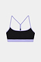 The SPLITS59 Emerson Airweight Bra in Black/Purple Haze features light purple trim and racerback straps, made from stretchy nylon spandex for comfort. Perfect for athletic wear, it's displayed on a plain white background.