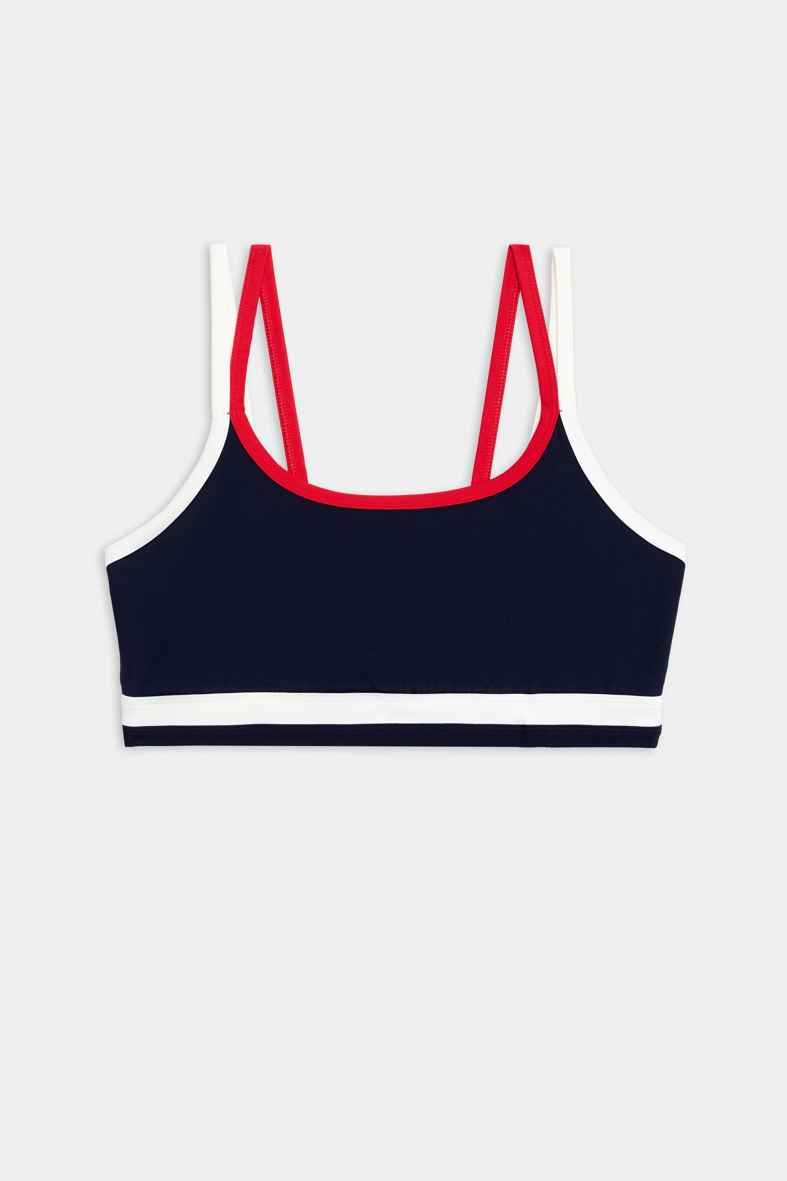 The SPLITS59 Eva Rigor Double Strap Bra in Indigo/White features contrast color accents and double red straps, shown on a plain background—perfect for gym workouts.