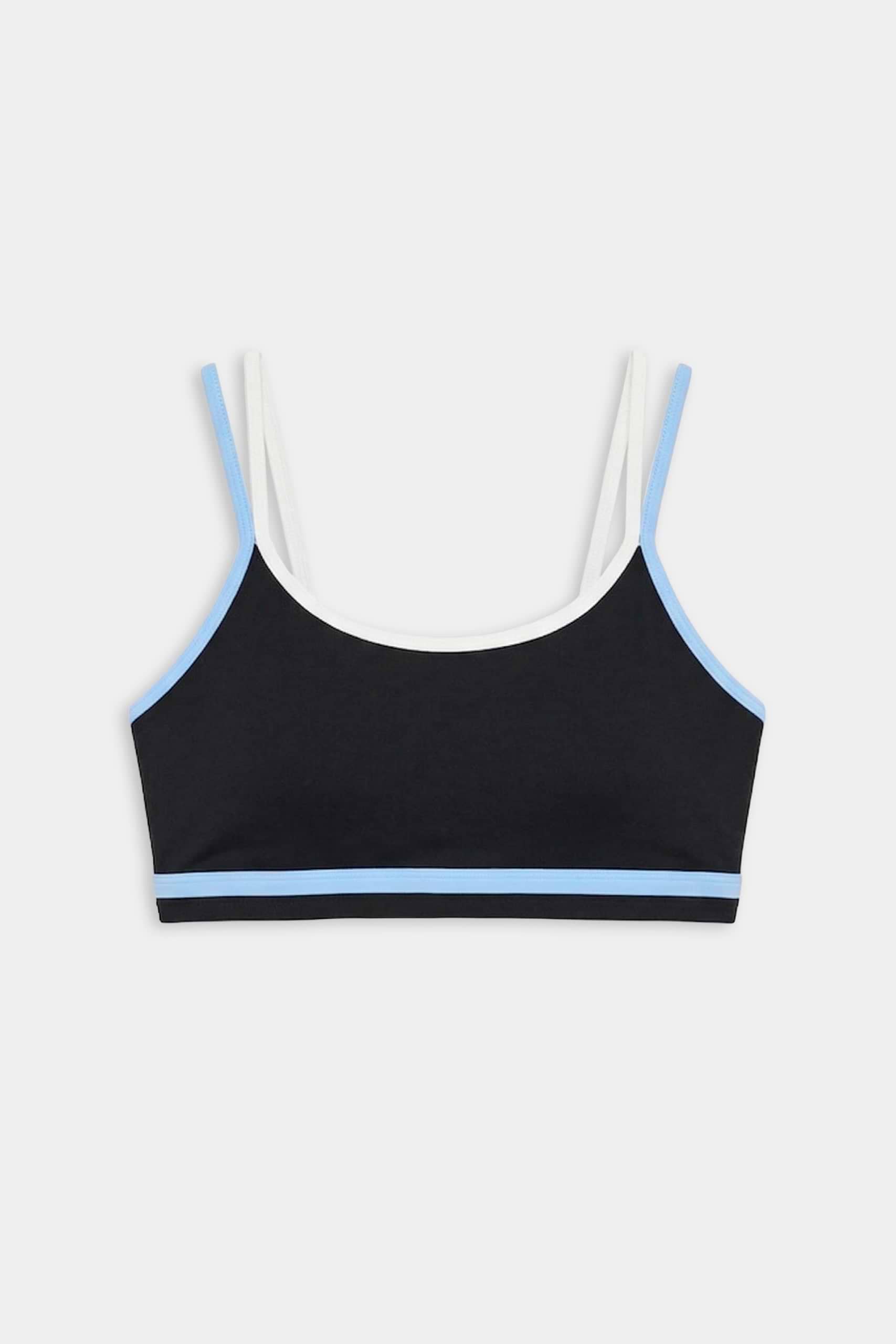 The SPLITS59 Eva Rigor Double Strap Bra in Black/Skylight features blue trim, white shoulder straps, and is shown on a plain white background.