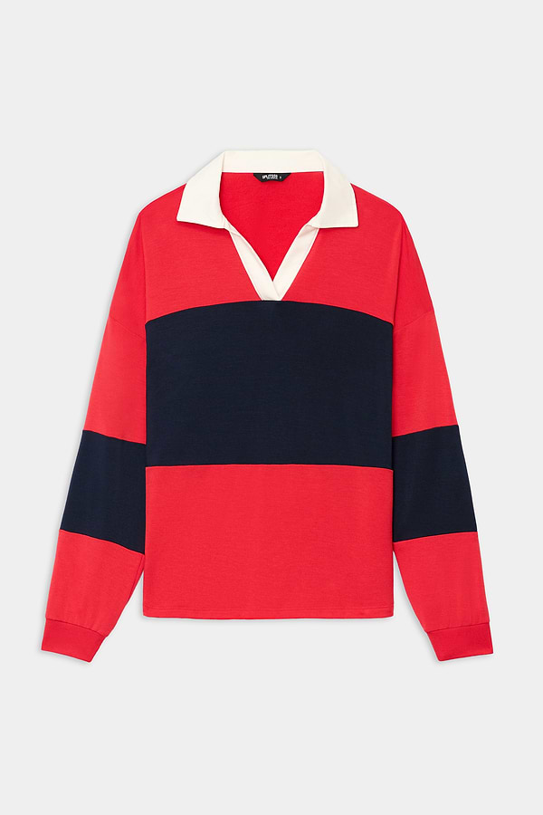 The SPLITS59 Katie Fleece Rugby in Pirate Red/Indigo features long sleeves, red and navy horizontal stripes, a white collar, and a V-neck opening, shown on a plain background.