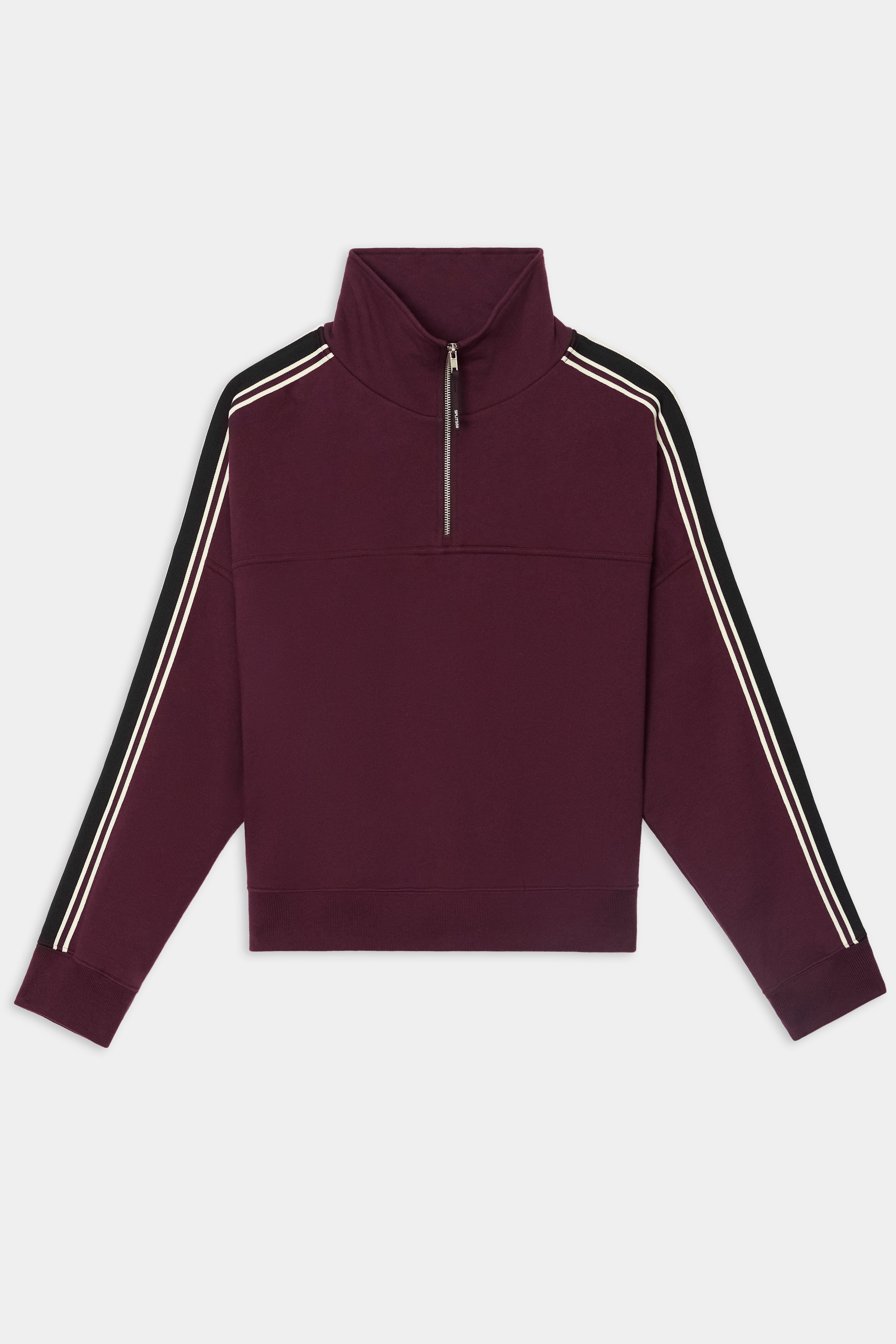 The SPLITS59 Goldie French Terry Oversized Half Zip in Dark Cherry/Black features a maroon cotton fabric with black sleeves, white double stripes along the shoulders and arms, and a half-zip collar. Displayed flat on a white background.