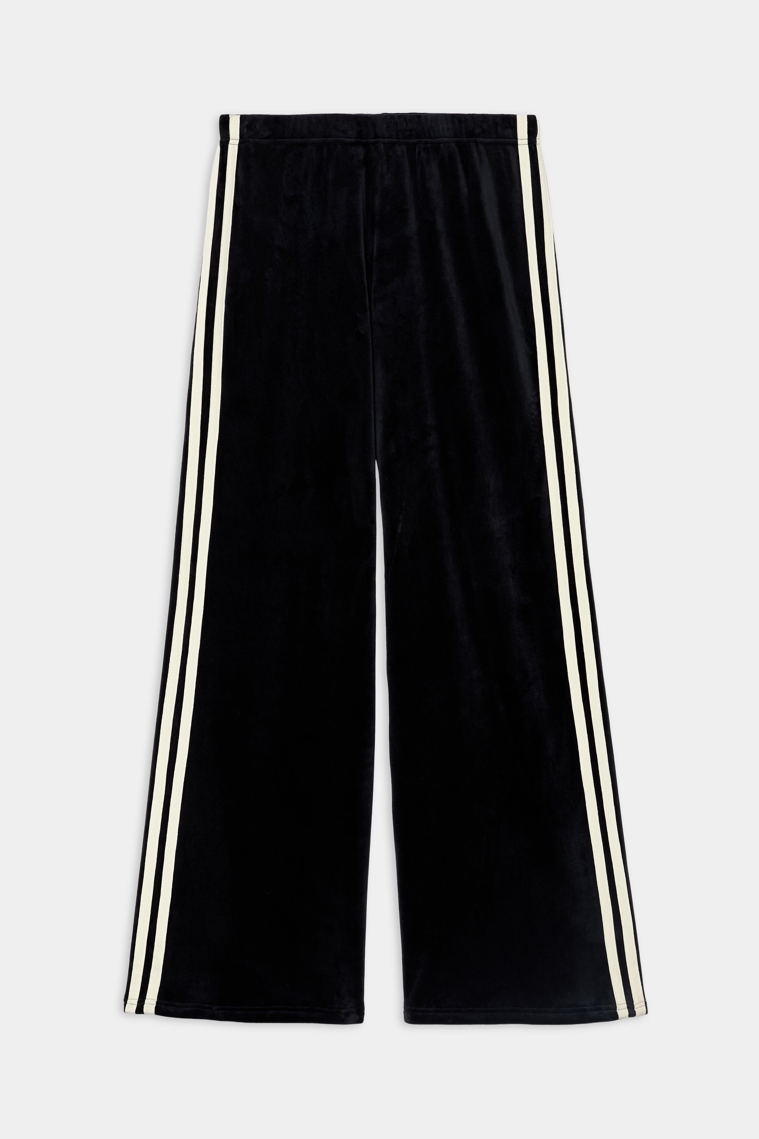 The SPLITS59 Heritage Velour Pant - Black/Creme features soft black velour with creme side stripes, made from a polyester-spandex blend and shown flat on a white background.