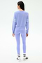 A person faces away, wearing the SPLITS59 Brooks Stripe Fleece Sweatshirt in Purple Haze/White and matching leggings made in Los Angeles, plus white socks with black text and gray sneakers, set against a plain white background.