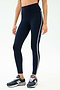 Wearing SPLITS59 Amber Airweight High Waist 7/8 leggings in Indigo/White, perfect for hot yoga, paired with dark blue New Balance sneakers, set against a plain light background.
