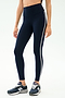 Wearing SPLITS59 Amber Airweight High Waist 7/8 leggings in Indigo/White, perfect for hot yoga, paired with dark blue New Balance sneakers, set against a plain light background.