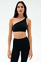 Person standing against a plain background, wearing the SPLITS59 Josie Airweight One Shoulder Bra in Black/White and high-waisted black leggings—perfect for hot yoga sessions.