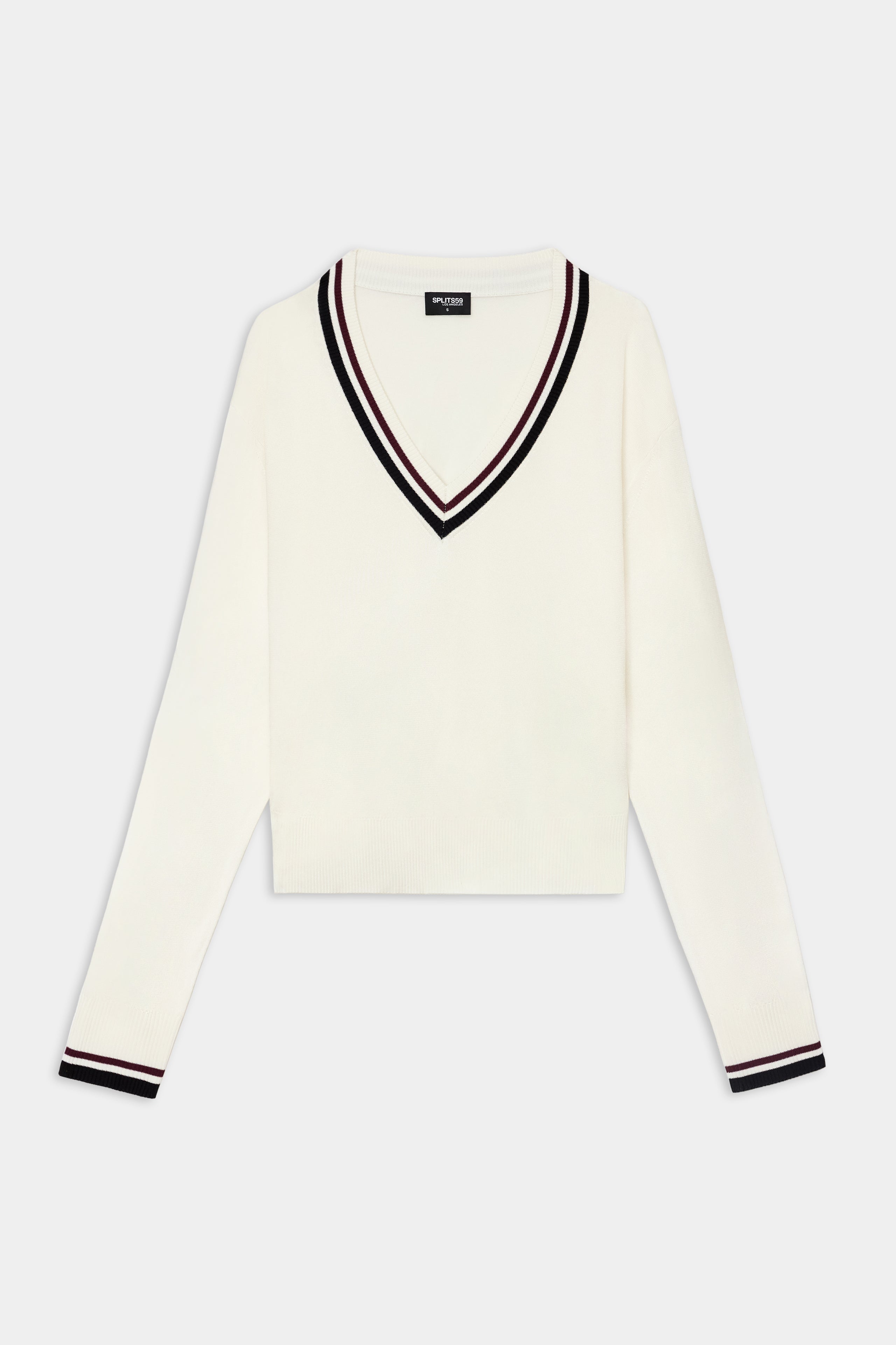 The SPLITS59 Jemma Knit V Neck in White/Black is crafted from a soft rayon and nylon blend, and features black and burgundy striped trim on the collar and cuffs. Displayed laid flat on a plain background.