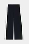 The SPLITS59 Jordan Nylon Twill Tearaway pants in Black/Creme are wide-leg pants crafted from a nylon-spandex blend, featuring white snap button panels running down the sides, and are displayed flat against a white background.