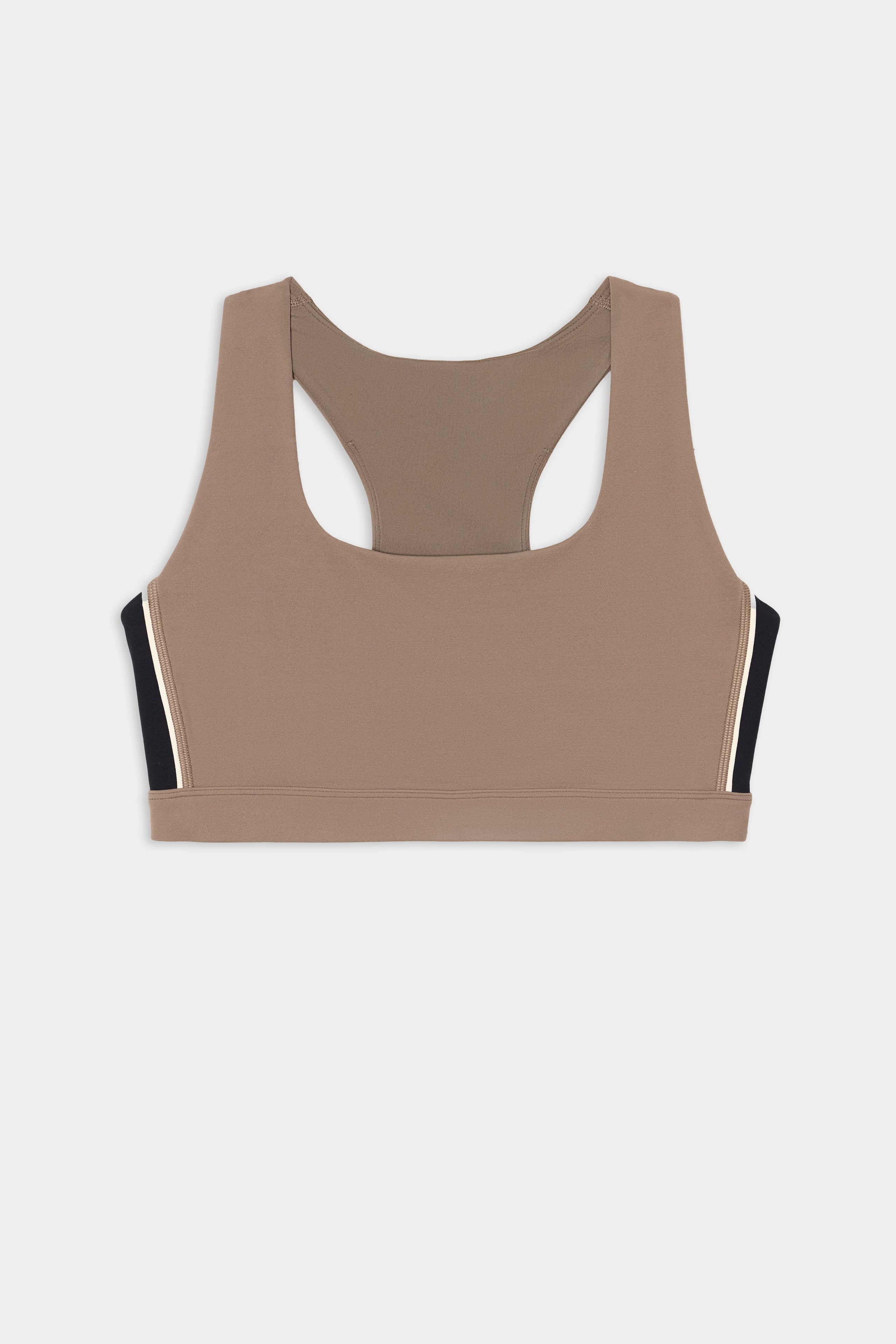 SPLITS59 Lexi Rigor Bra in Lentil/Black—a racerback sports bra featuring black and white side panels, crafted from a soft nylon-spandex blend—displayed flat on a white background.