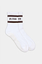 The SPLITS59 Logo Stripe Ankle Socks With Grip feature brown stripes and the "SPLITS59" text on the cuffs, shown against a plain background.