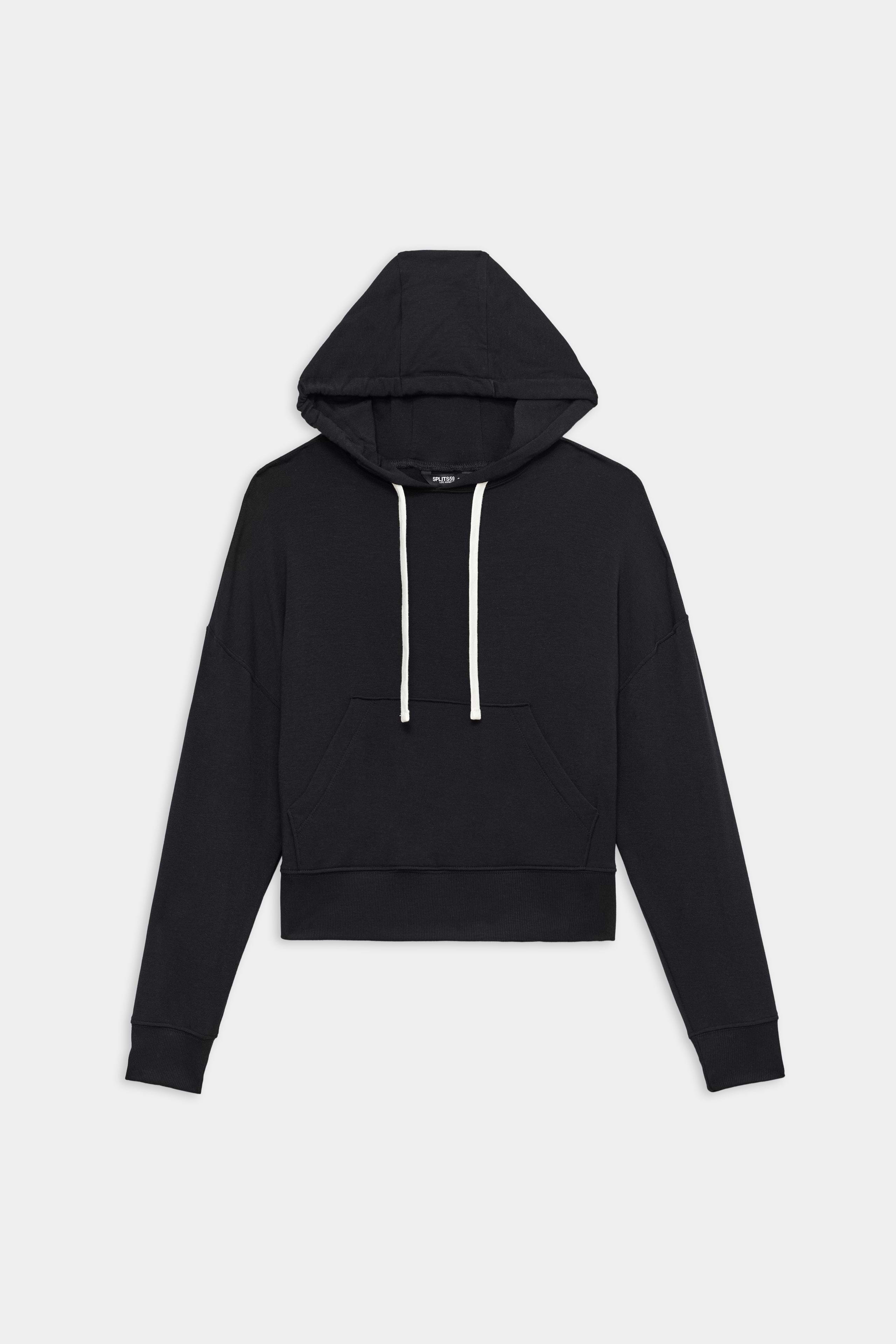 The SPLITS59 Joey Fleece Hoodie - Black features a soft spandex blend, long sleeves, front kangaroo pocket, and white drawstrings. Displayed on a plain white background.