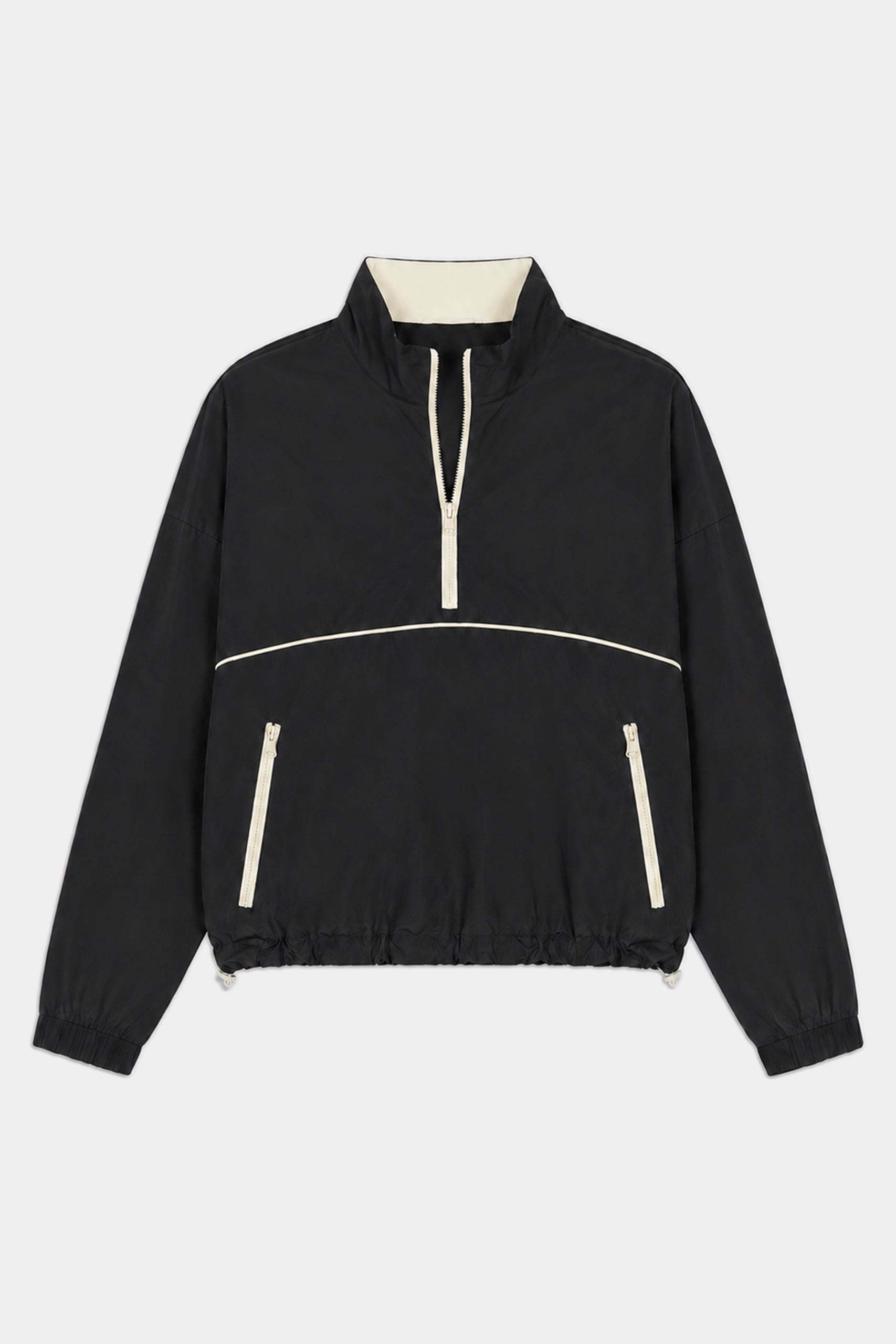 The SPLITS59 Lyle Woven Nylon Pullover in Black/Creme features a half-zip front, stand-up collar, cream trim, two zippered pockets, and elastic cuffs. Made from nylon with a hint of spandex for comfort and flexibility.
