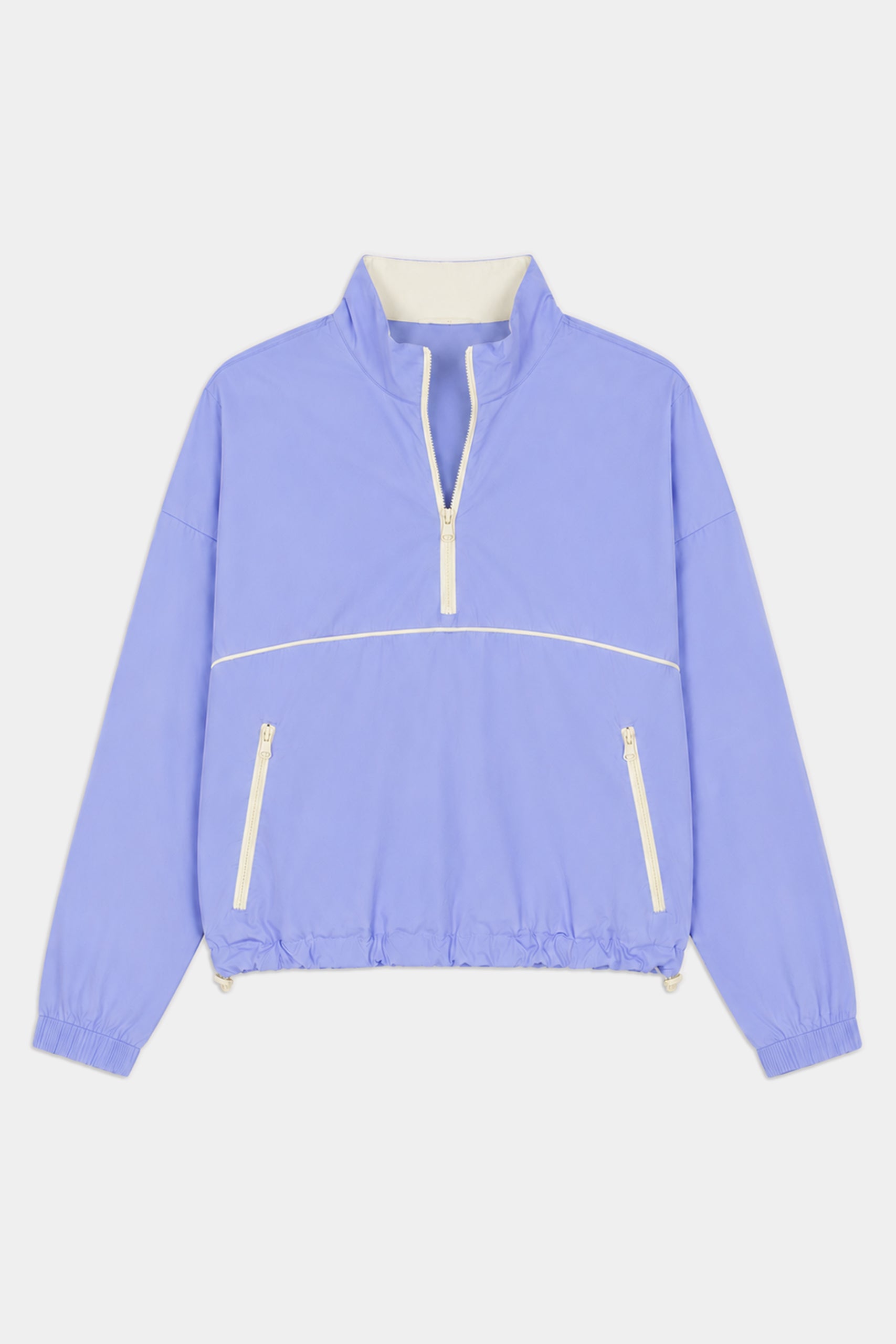 The SPLITS59 Lyle Woven Nylon Pullover in Purple Haze/Creme features a soft nylon-spandex blend, white zipper accents, high collar, elastic cuffs and hem, and two front zippered pockets.