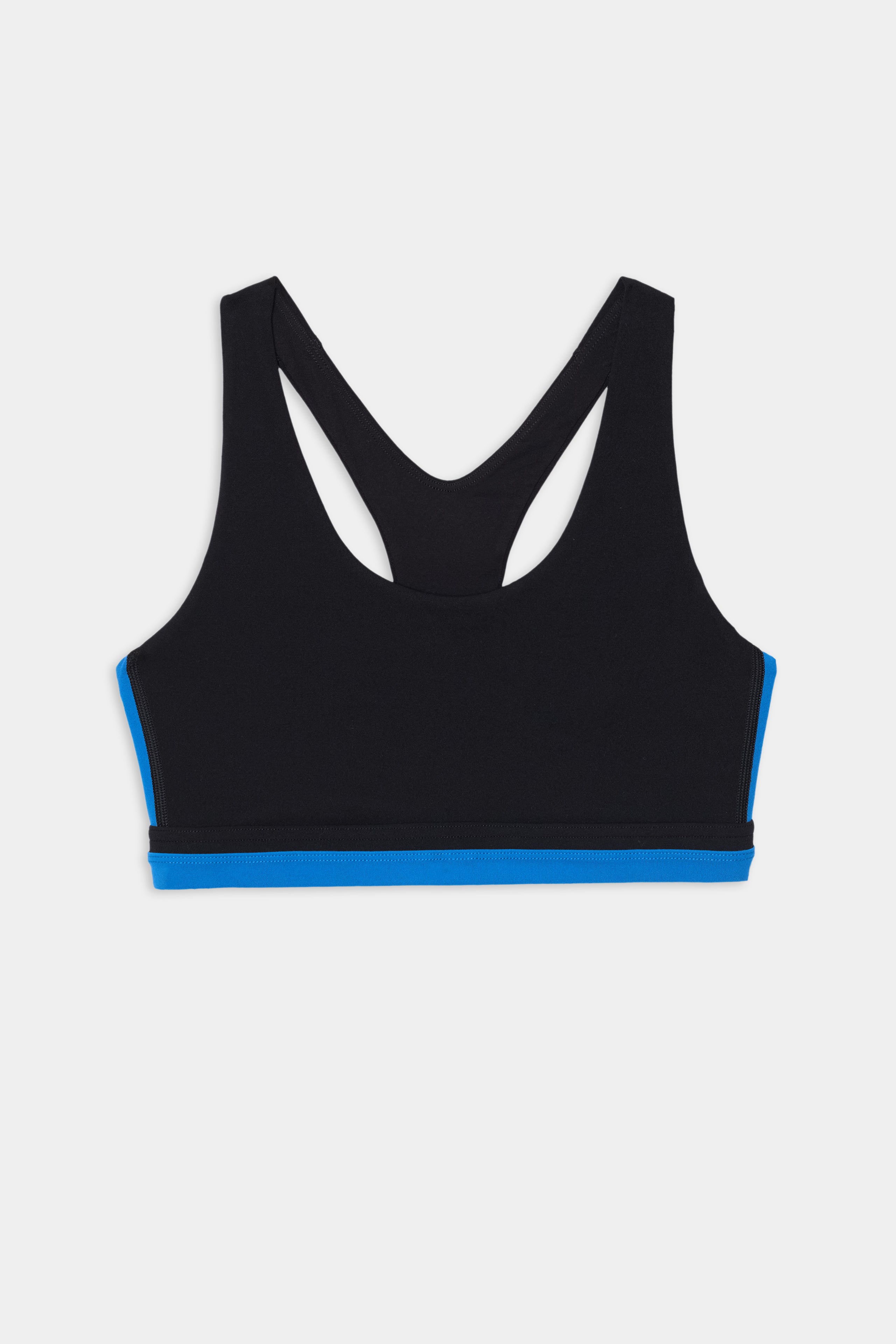 The SPLITS59 Maci Airweight Bra in Black/Classic Blue features a racerback design with a sporty contrast stripe and blue trim at the bottom, perfect for gym workouts, shown against a white background.