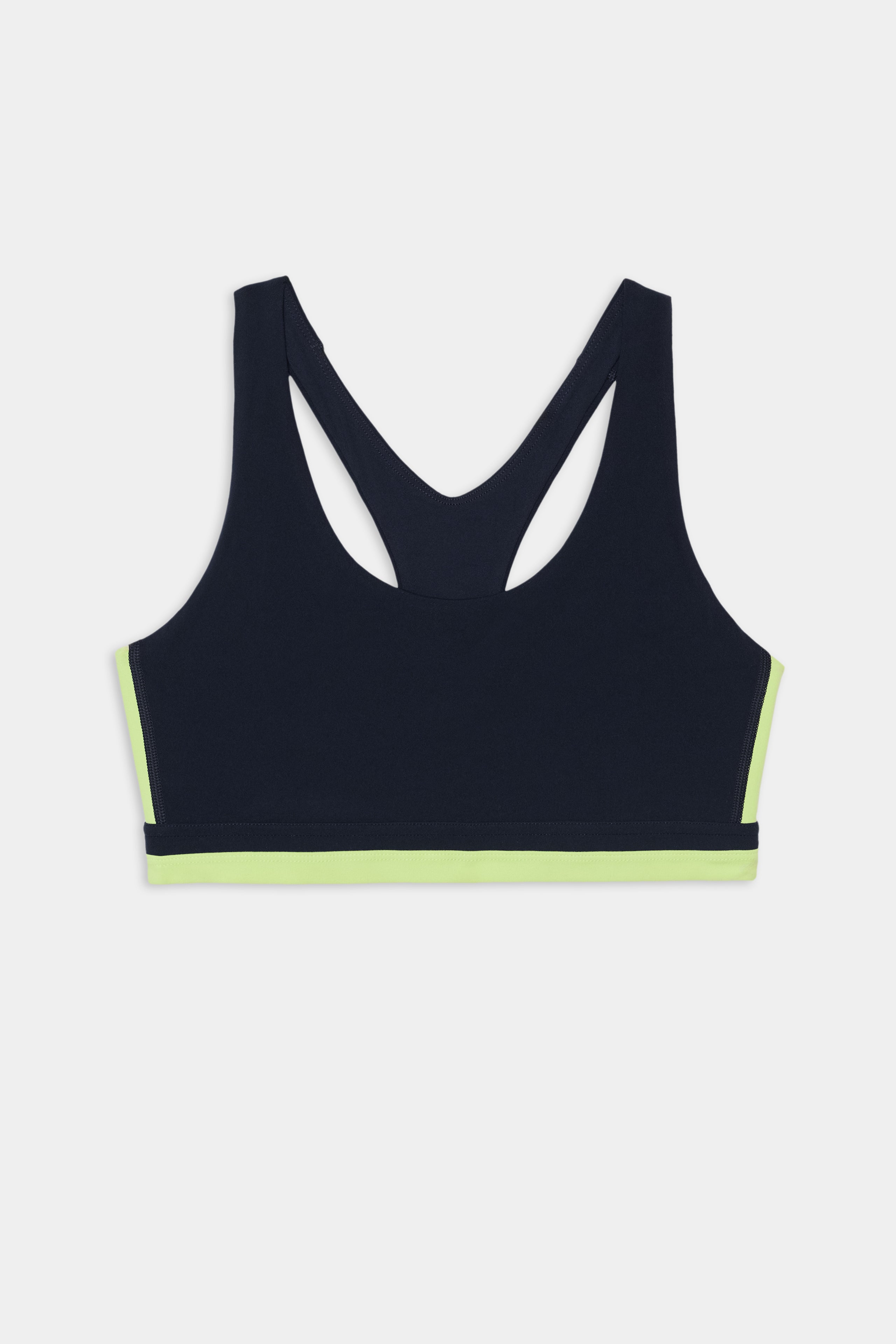 The SPLITS59 Maci Airweight Bra in Indigo/Limeade features a racerback design and a vibrant limeade band at the bottom, displayed on a plain white background.