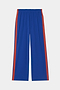 The SPLITS59 Maxie Rigor Track Pant - Cobalt/Terracotta features stretchy wide legs, elastic waistband, and terracotta red stripes, shown flat on a white background.