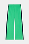 The SPLITS59 Maxie Rigor Trackpant in Grass/Indigo features a bright green wide-leg design, elastic waistband, and dark indigo side stripes, shown laid flat on a white background.