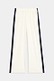 The Maxie Rigor Track Pant in white and indigo from SPLITS59, made from rigor fabric with an elastic waistband, is shown on a plain background.