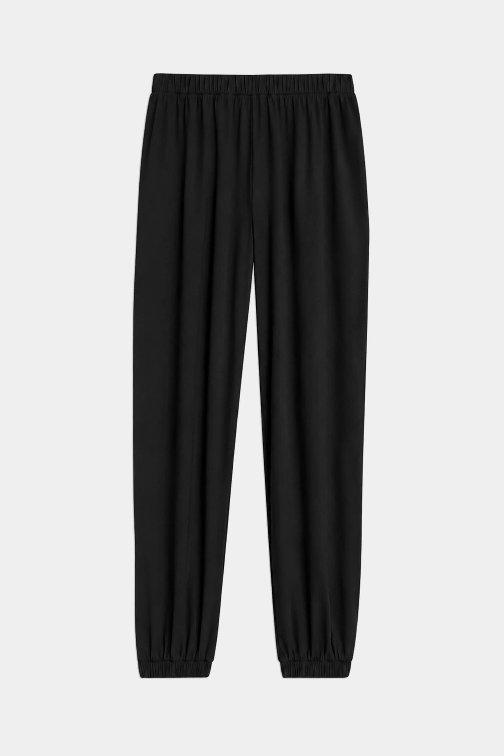 The SPLITS59 Megan Woven Nylon Jogger in black features a lightweight design with a cinched waistband and elastic cuffs, shown laid flat on a light background.
