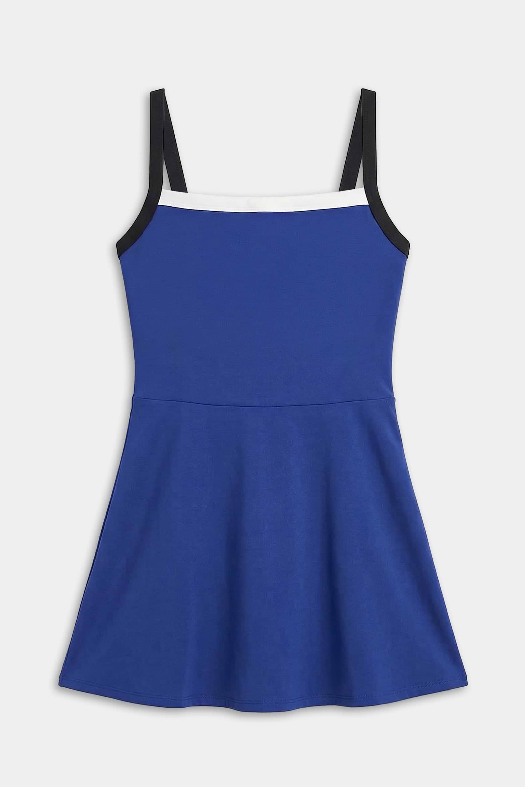 The SPLITS59 Monah Rigor Dress in cobalt and black features a sleeveless design, black shoulder straps, and a white neckline trim, shown flat on a white background.