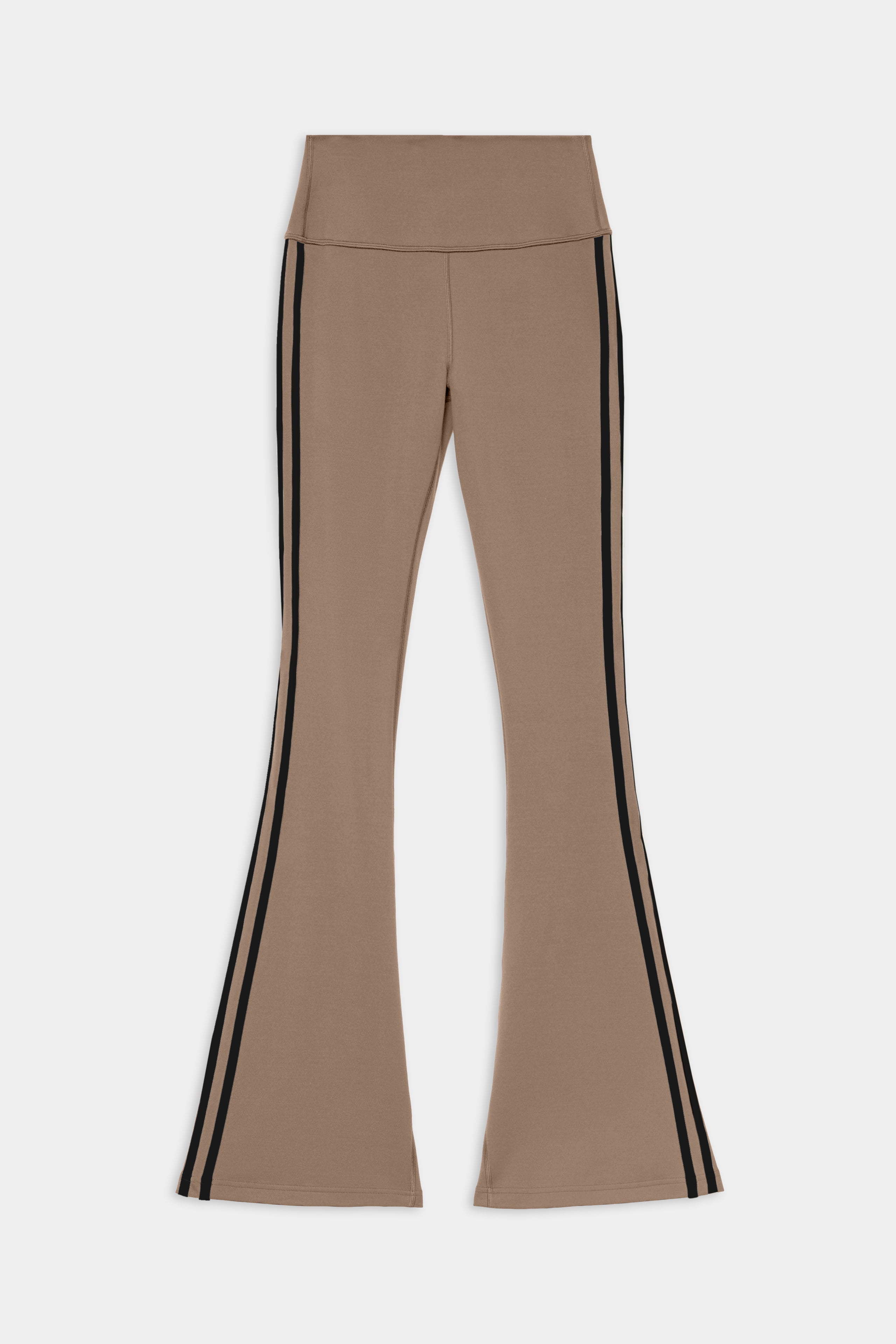 The SPLITS59 Raquel High Waist Supplex Flare in Lentil/Black features beige flared pants accented with black vertical stripes along the outer legs, crafted from a comfortable spandex and nylon blend and shown flat against a white background.