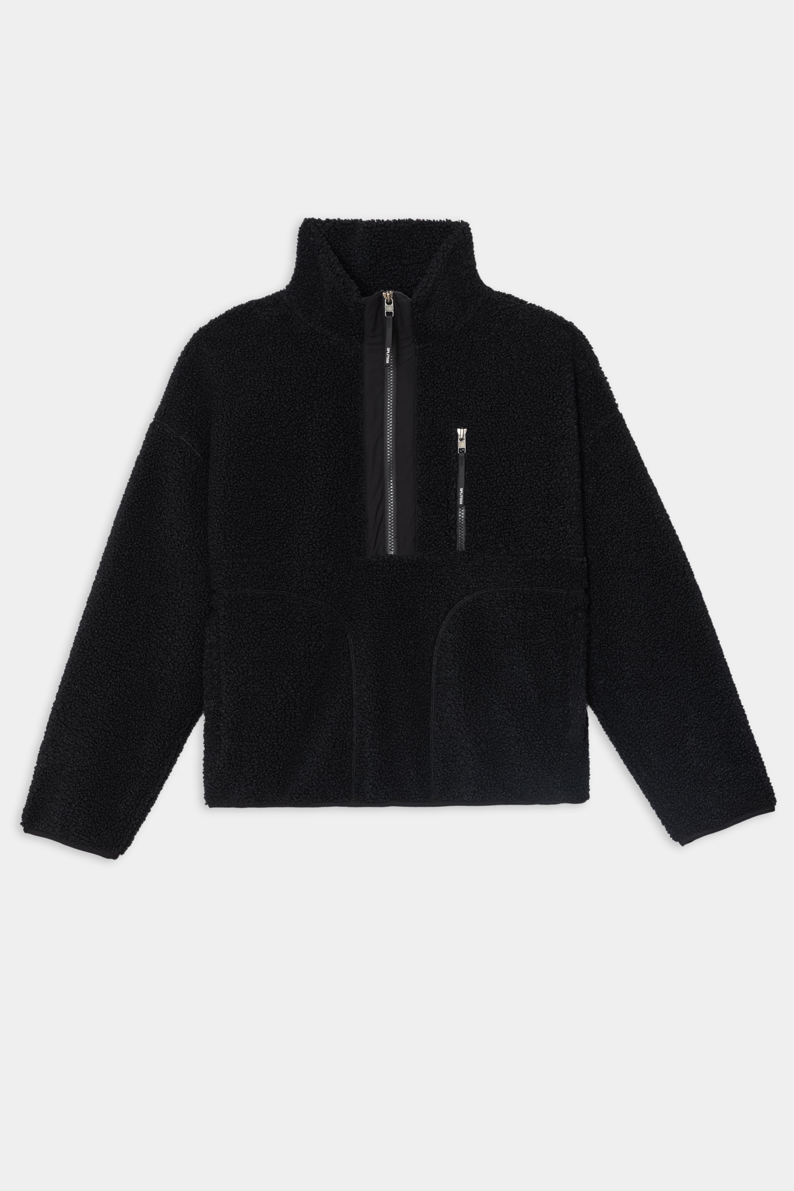 The SPLITS59 Reese Sherpa Half Zip Pullover in black, crafted from soft 100% polyester, features a high collar, half-zip front, zippered chest pocket, and two front hand pockets, shown laid flat on a white background.