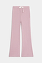 The SPLITS59 Blaire Rib Pant features a light pink, wide-leg knit design with an elastic waistband and white drawstring, shown laid flat on a plain white background.