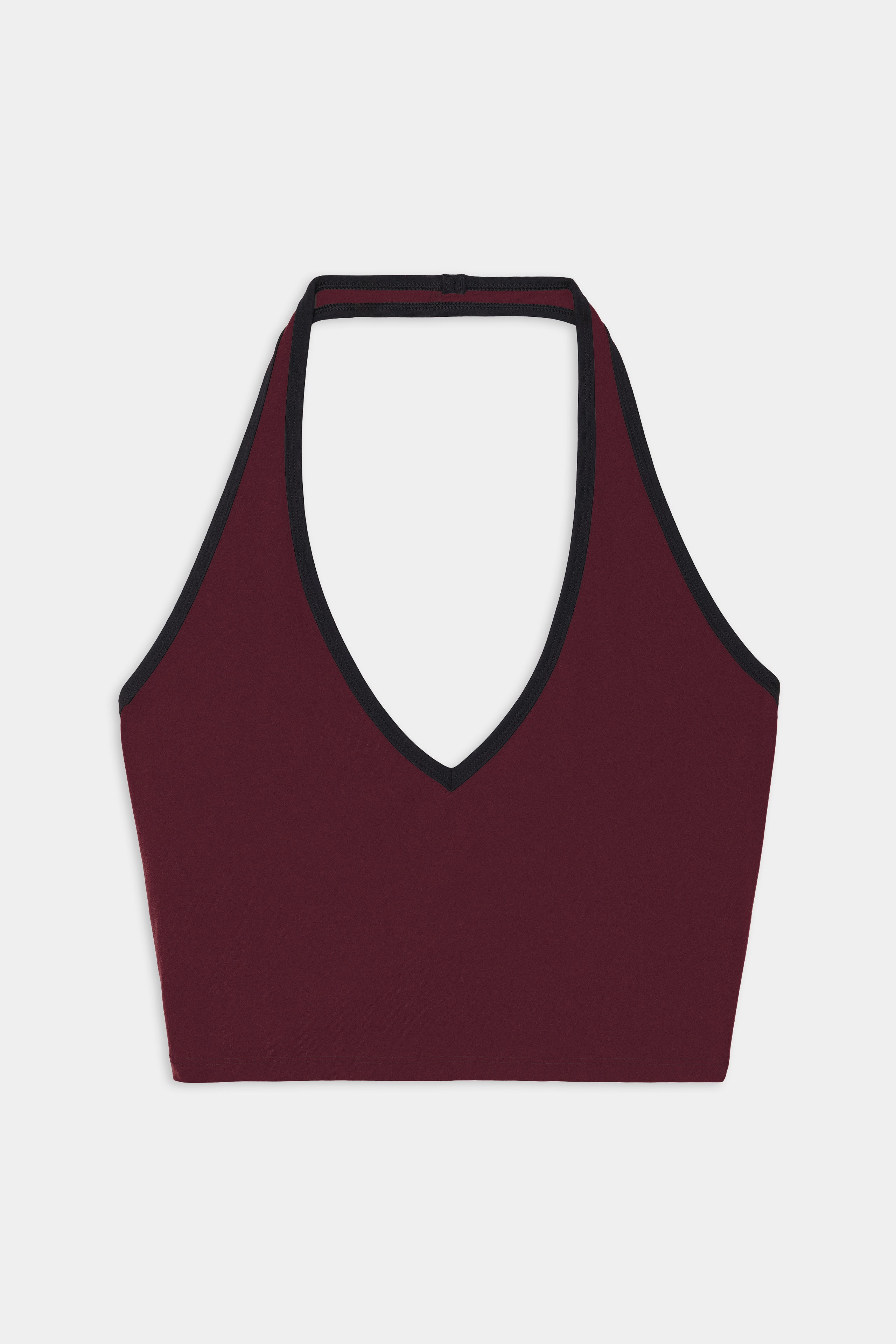 The SPLITS59 Rory Airweight Halter Bralette in Dark Cherry/Black features a halter-style design with a deep V-neckline and black trim, crafted from a stretch material for a comfortable fit, shown laid flat on a white background.