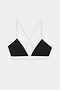The SPLITS59 Sage Rigor Bra in Black/White is crafted from a soft nylon-spandex blend, featuring thin double straps that cross at the back and white trim, displayed on a white background.
