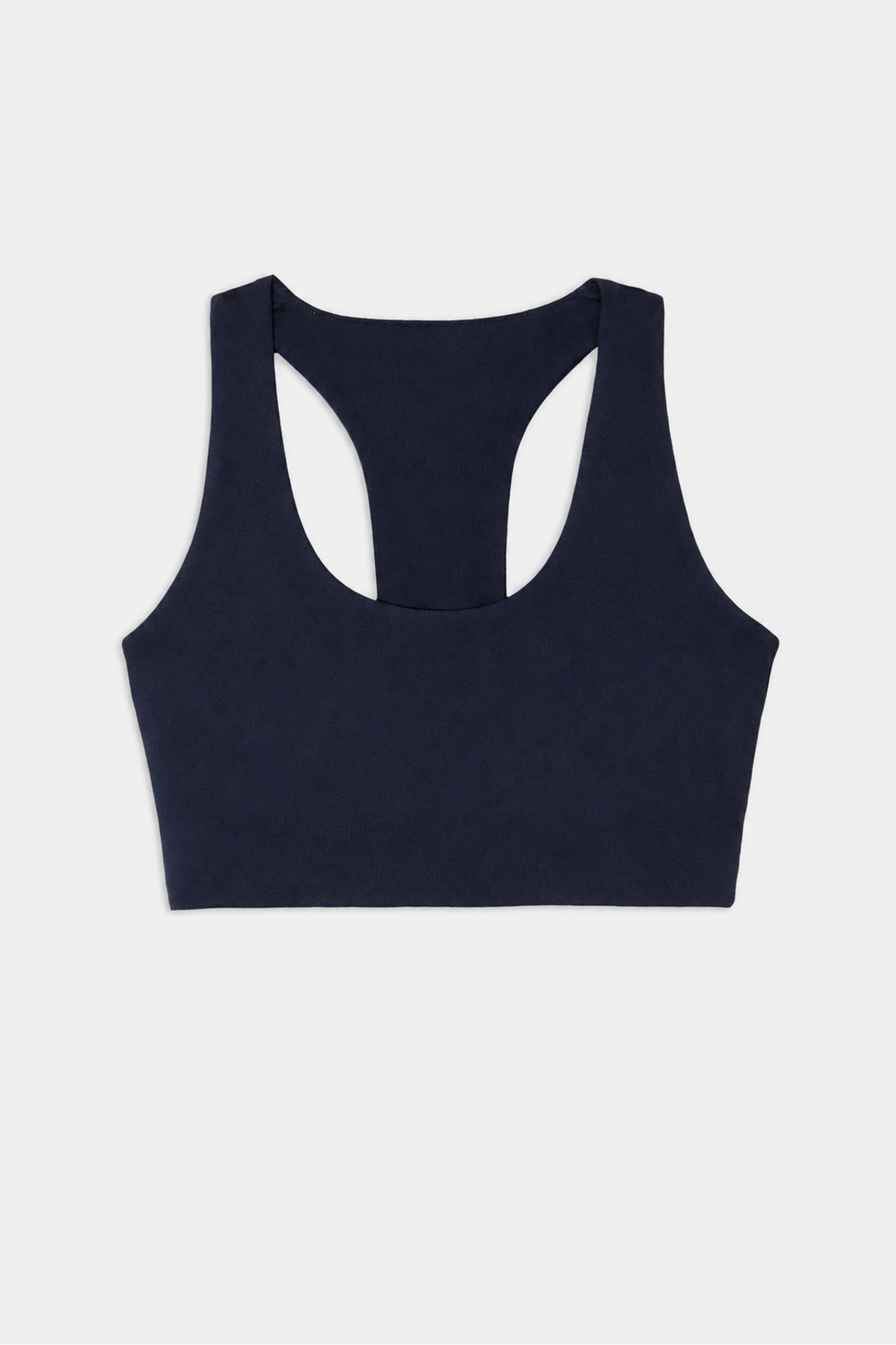 The SPLITS59 Sara Airweight Bra in Indigo is showcased on a white background—ideal for hot yoga or Pilates sessions.